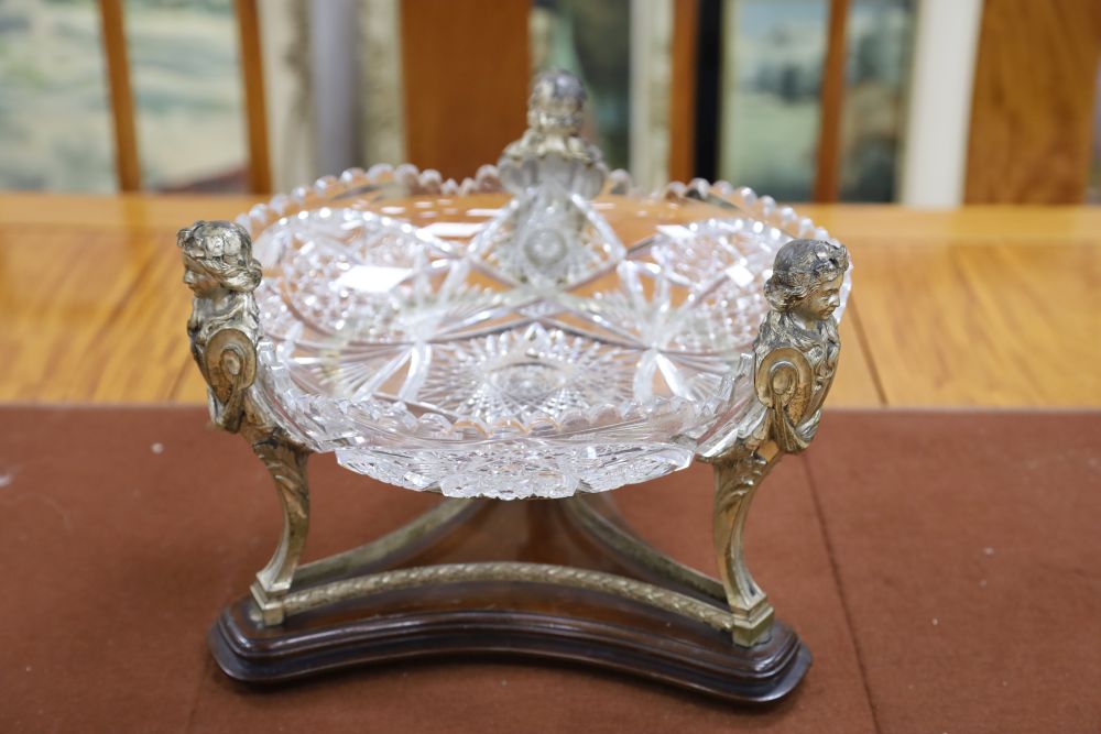 A 19th century silver plated figural centrepiece with deeply cut glass bowl, 34cm diameter